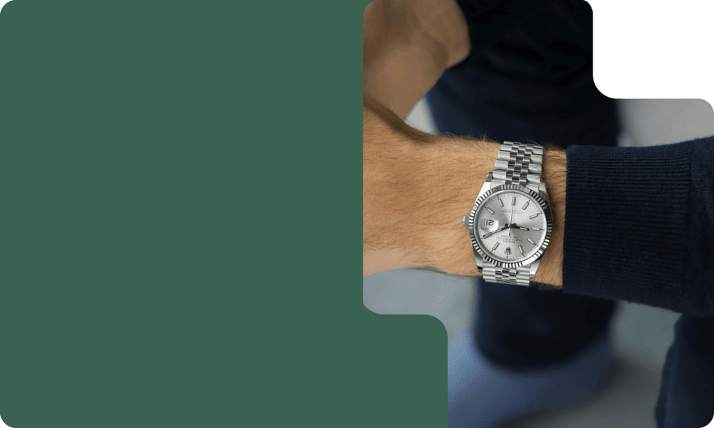 Stainless steel Rolex watch with a silver dial and date display, perfect for luxury watch enthusiasts.