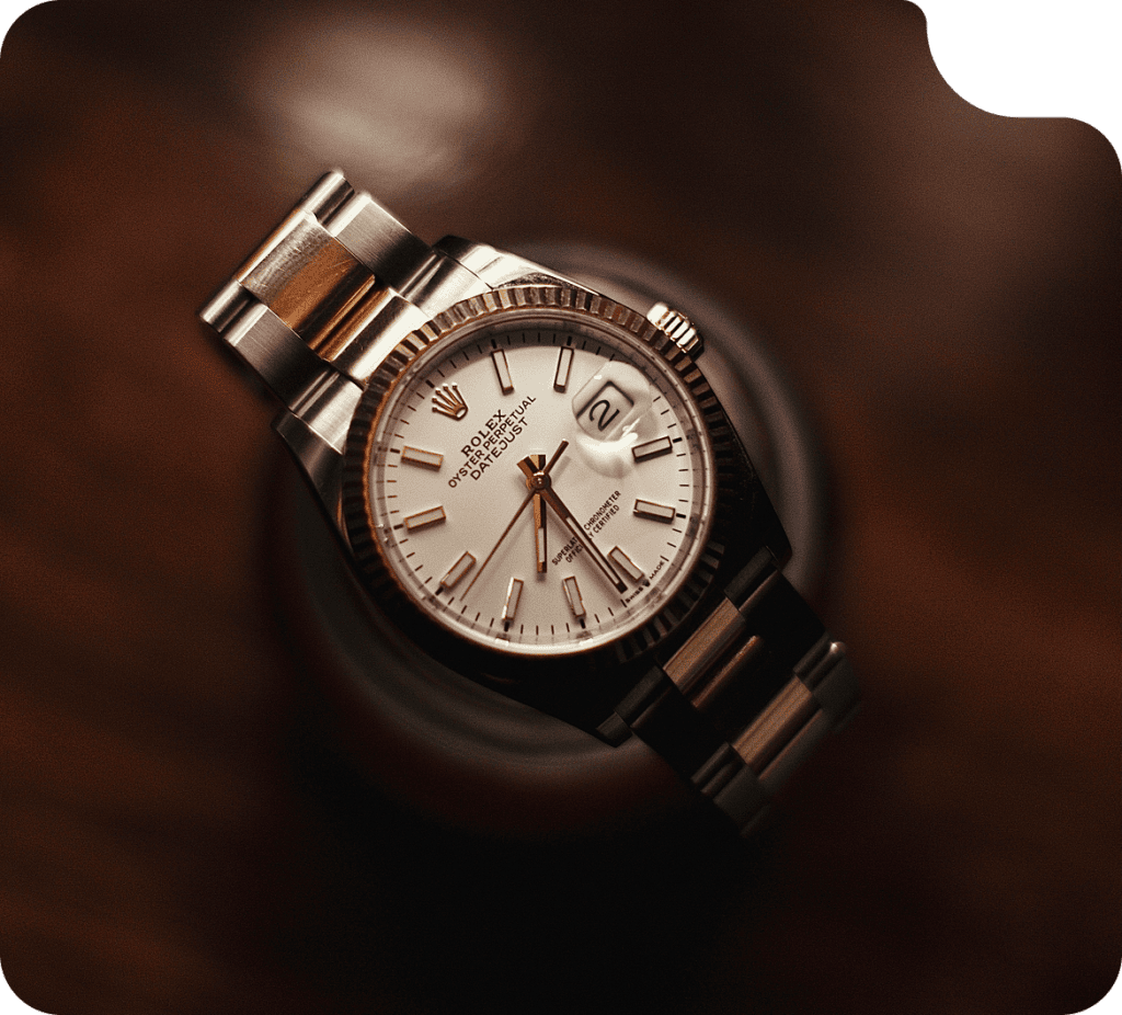 Luxury Rolex Datejust watch featuring a white dial, date window, and elegant design.