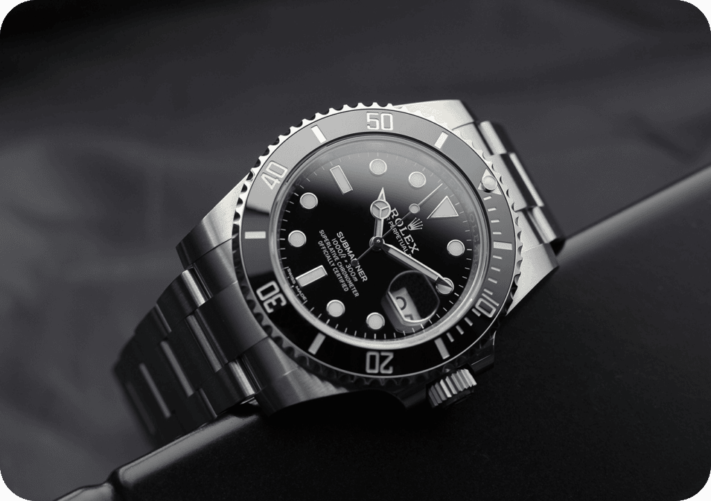 Luxury Rolex Submariner with black dial, stainless steel bracelet, and rotatable bezel.